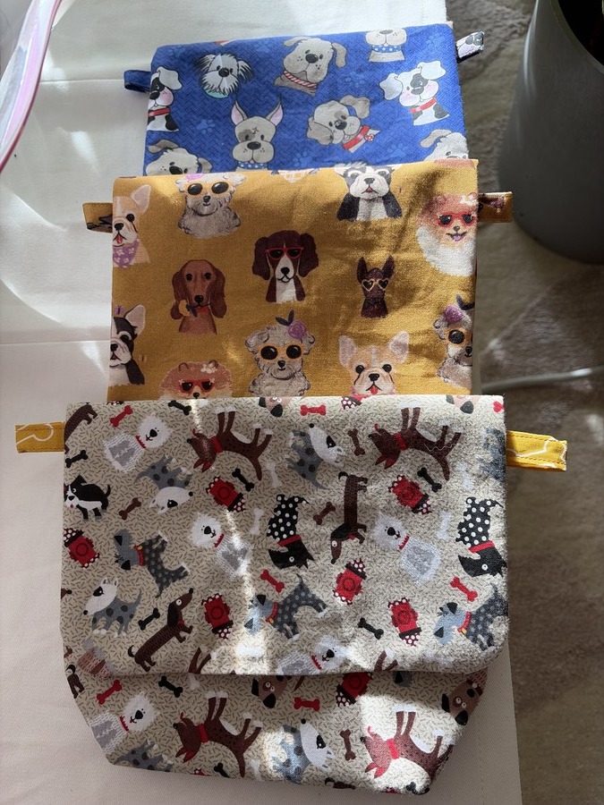 Stacked dog-print pouches