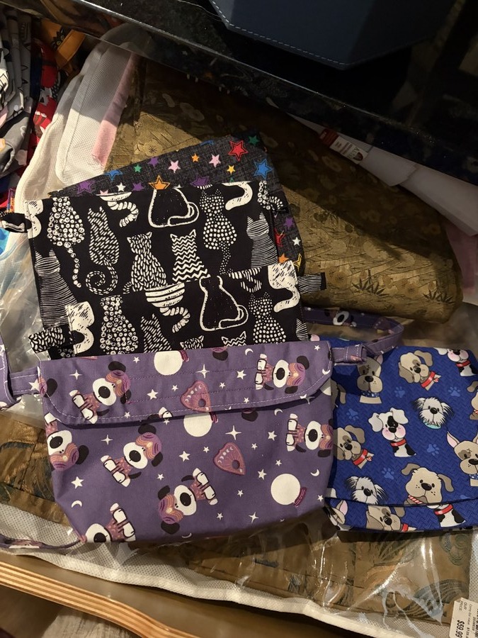 Purple aviators, graphic cats & star bags